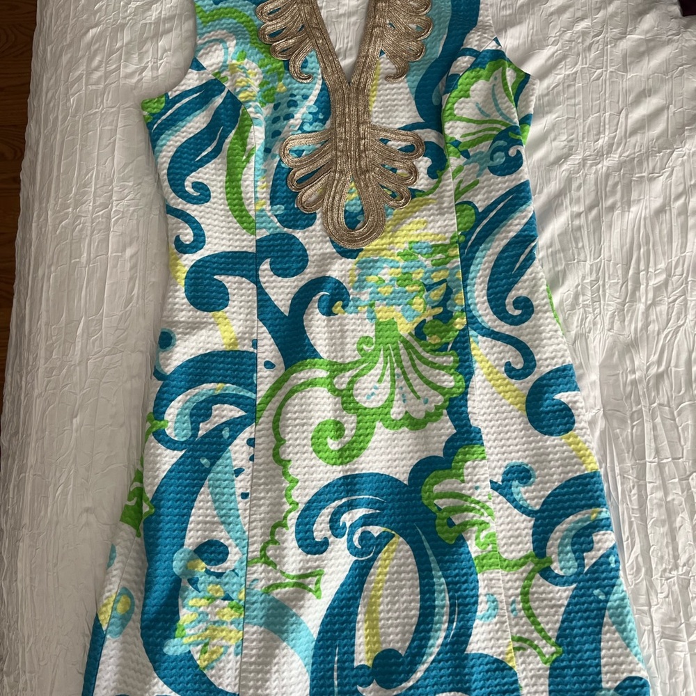Vibrant Sleeveless Dress with Gold Embellishment